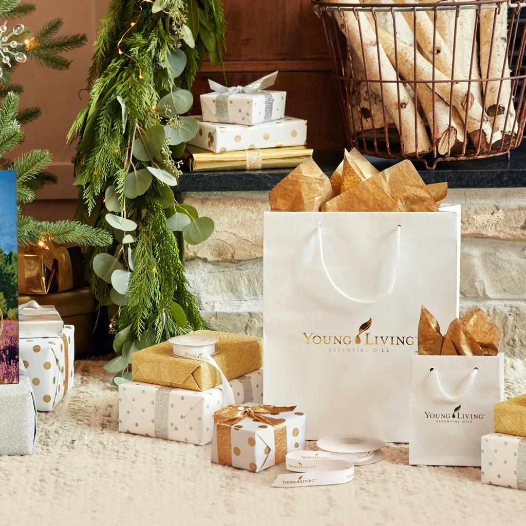 A touch of PERFECTION Add a touch of perfection to your gifts this season with Young Living branded gift bags and ribbon.