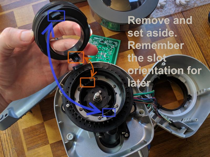 Rotate the grind adjuster clockwise (second pic) until the upper burr holder