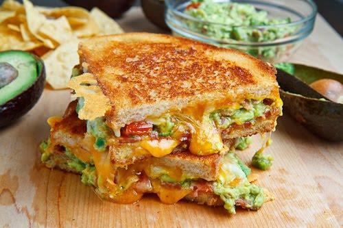 11 Sandwiches Bacon Guacamole Grilled Cheese 2 slices of bread 2 slices bacon (try with turkey bacon) 1 tablespoon butter, room temperature 1/2 cup shredded cheese of your choice 4 tablespoons