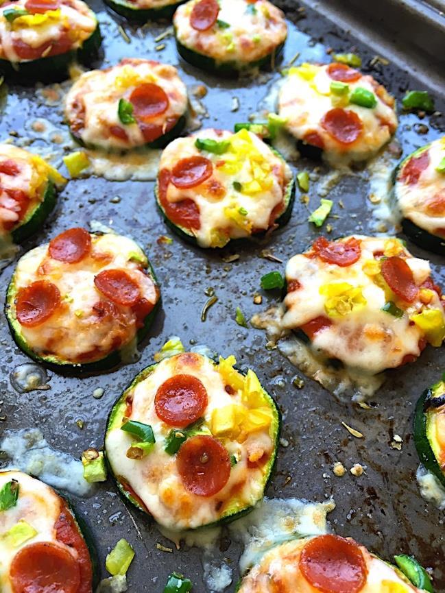 27 Zucchini Pizza Bites 1 tablespoon olive oil 3 zucchini, cut into 1/4-inch thick rounds Kosher salt and freshly ground black pepper to taste 1/3 cup marinara sauce 1/2 cup shredded mozzarella