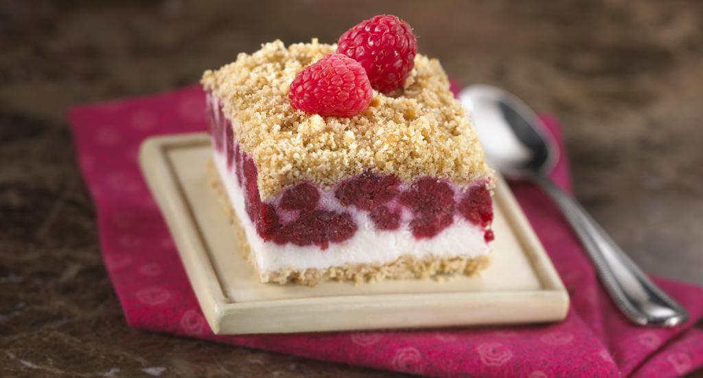 2 cups Keebler Vanilla Wafers, crumbled 1/4 cup butter OR margarine, melted 2 cups frozen red raspberries 1 cup half-and-half 3/4 cup sugar 1 cup sour cream Frozen Raspberry & Cream Squares Prep