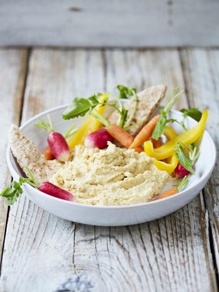 Simple houmous 1 x 400 g tin of chickpeas 1 small clove of garlic 1 tablespoon tahini 1 lemon extra virgin olive oil 1. Drain the chickpeas in a sieve over the sink. 2. Peel the garlic. 3.