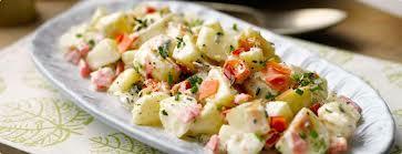 Potato Salad 200g/8oz new potatoes 1 tub of natural yoghurt or 2 tablespoons of low fat mayonnaise Chives, mint or mixed herbs 1. Chop the new potatoes into quarters.