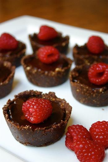 Dark Chocolate Fudge Tarts Crust: 1 generous cup almonds, ground 6 tablespoons cocoa powder 3 tablespoons pure maple syrup 3 tablespoons unprocessed coconut oil ½ teaspoon sea salt Filling: 1½ cups