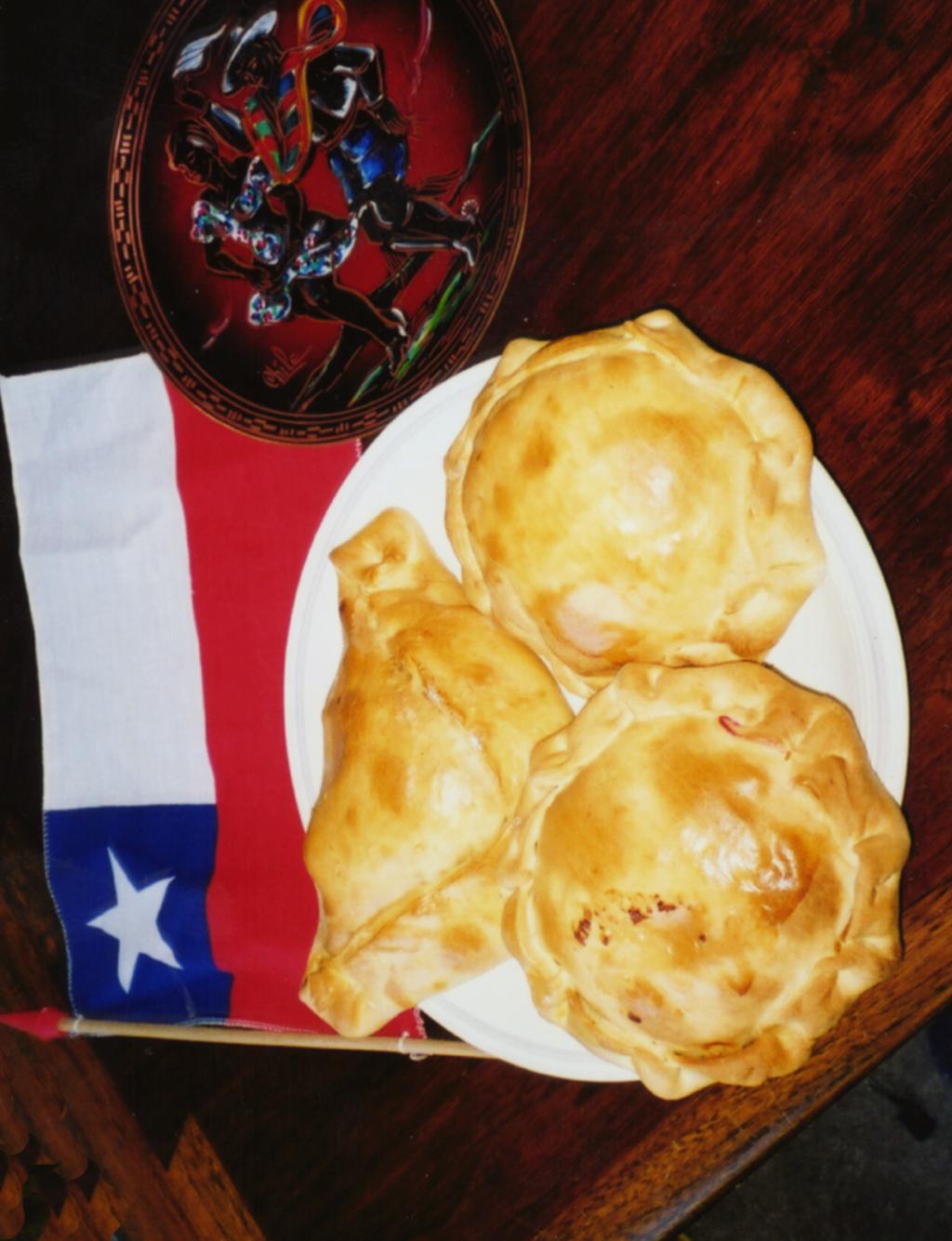 Traditions Visual 2: Empanadas, a Chilean Flag, and a Copper