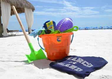 Day at the Beach beach bucket filled with assorted beach toys, sunscreen, and a Marco Island