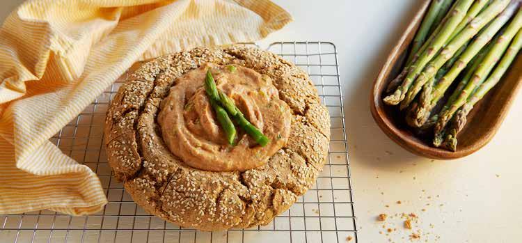 Rustic Bread Bowl with Sun-Dried Tomato and Asparagus Dip MAKES 1 LOAF AND 3 CUPS DIP READY IN 1 HOUR 15 MINUTES A no-knead, homemade bread bowl doubles as the serving vessel and the dippers for a