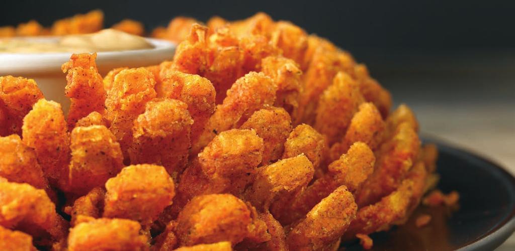 BLOOMIN ONION AUIE-TIZER BLOOMIN' ONION An Outback Original! Our special onion is hand-carved, cooked until golden and ready to dip into our spicy signature bloom sauce. (1950 calories) 9.