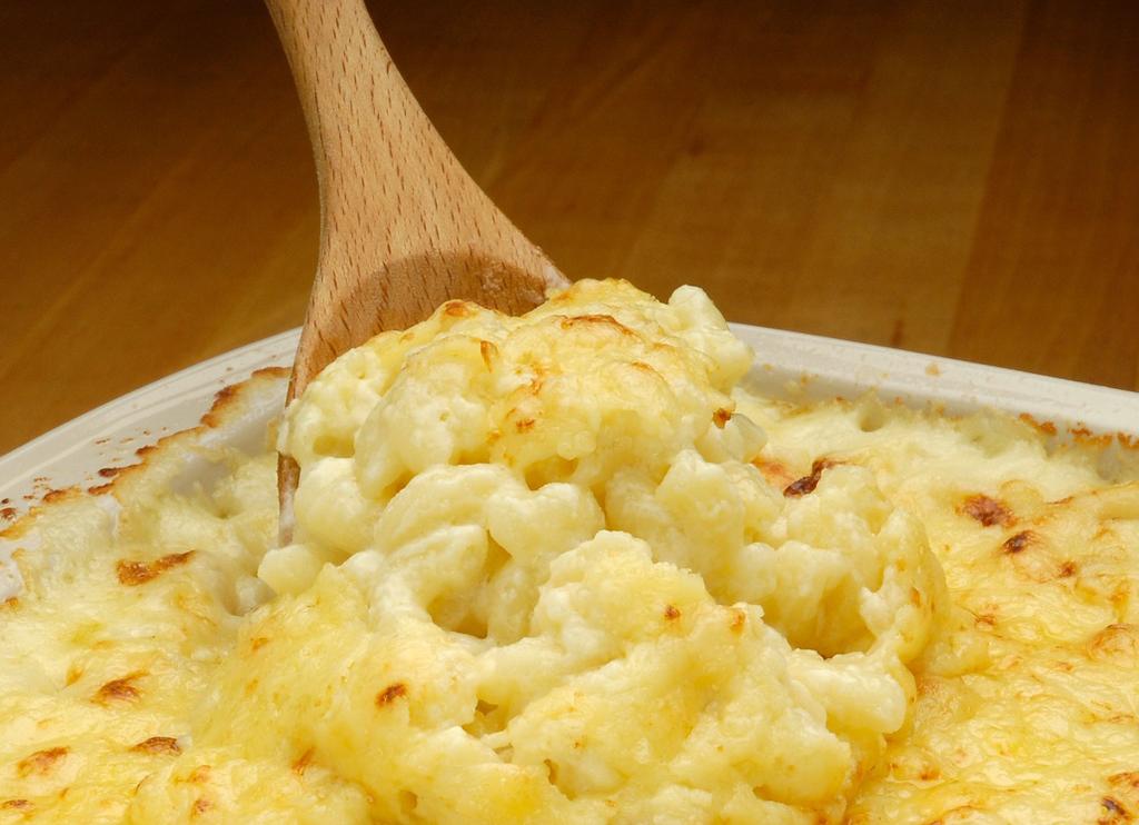 Drain. While macaroni cooks, melt butter over medium heat in a large, deep sauté pan.