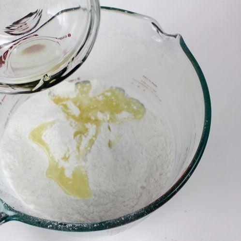 Slowly add your oils from the small bowl to the large bowl with the dry ingredients. See figure 4.