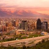 Santiago, s capital and largest city, lies in a valley surrounded by the snow-capped mountains of the Andes and the an Coastal Range.