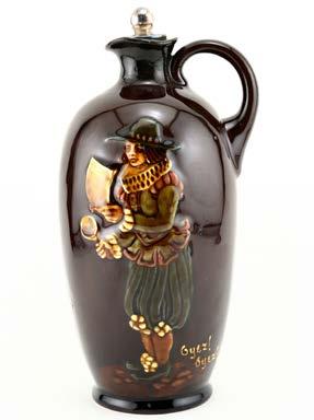 25 H $375 This two-tone blue and brown Royal Doulton stoneware Old Scotch Whisky bottle carries the portrait of King George IV.