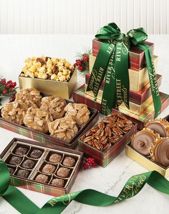 Holiday Gift Tower The 5 Tier Holiday Gift Tower contains our World Famous Pralines, Milk Chocolate Bear Claws, Nutty Caramel Corn, Milk and Dark Chocolate Sea Salt Caramels and crunchy Glazed Pecans.