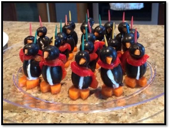 Olive Penguins 1. Use jumbo pitted black olives as the body and slice each one down the front. 2. Fill with softened cream cheese (if you can get an oral syringe, it really helps). 3.