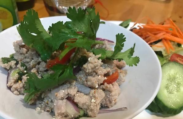 9 Rustic mixture of minced chicken, onions, chili, lime, and mint served warm with fresh vegetables E2. Som Tam $13.
