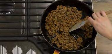 Drain fat if necessary. Stir in 5 teaspoons Taco Seasoning and remaining ½ cup water.