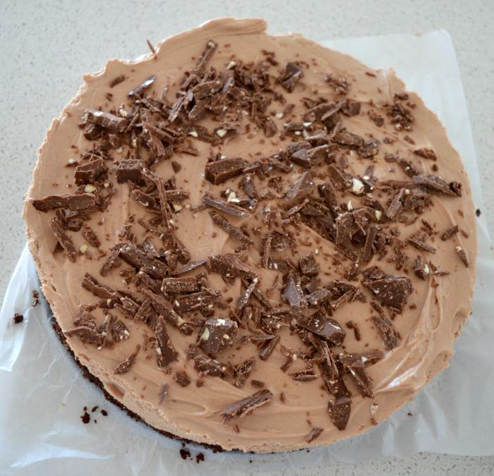 TOBLERONE CHEESECAKE 1 cup of crushed chocolate ripple biscuits 100g of melted butter ¼ cup of almond meal (ground almonds) For the Filling: 500g of cream cheese softened ½ cup of caster sugar 200g