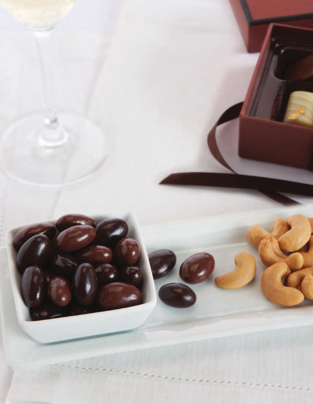The open box is filled with our Chocolate All Berry Mix, Jumbo Cashews, Orange Cookies, Butter Shortbread Cookies, Jumbo