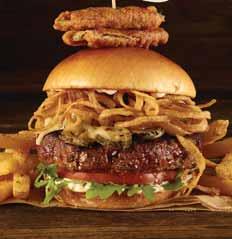 00 CLASSIC CHEESE BURGER 6-oz burger, topped with crisp lettuce, vine-ripened tomato, red onion and layered with melted cheddar cheese.* 23.