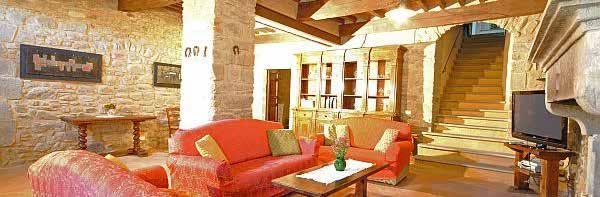 On the ground floor there is a wine cellar, a large living-room with ancient stone fireplace, bathroom, a