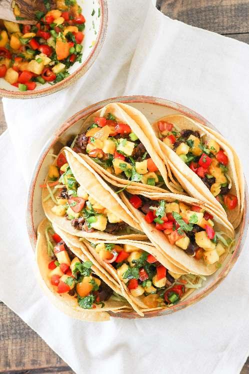Black Bean Tacos with Tropical Salsa Serves 2 // 25 minutes 3Ingredients: Beans: 2 teaspoons grapeseed oil ¼ cup diced red onion 1 cup cooked black beans 1 teaspoon cumin 1 teaspoon chili powder 1
