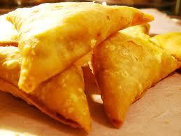 Samosas 1 packet of filo pastry 100g / 4oz cooked new potatoes (Skin on) 1 small onion Half a pepper 1 teaspoon of curry powder or curry paste Half a can of chopped tomatoes 1 teaspoon of pickle e.g. Branston (optional) 1.