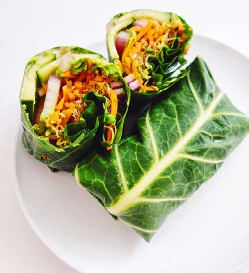 V EG G I E C O L L A R D WRAP 2 SERVINGS 4 large cleaned and dried collard green leaves 4 tablespoons Cauliflower Hummus (see page 11) ½ avocado, sliced lengthwise 8 pieces cucumber, sliced very
