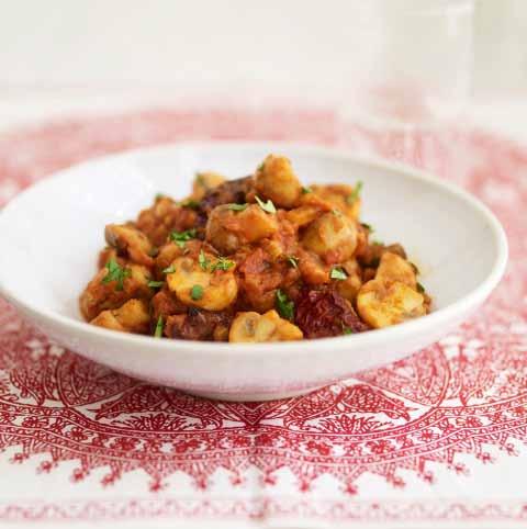 Kadahi Gucci Mushrooms with Tomatoes 3 tablespoons oil 2 dried red es, left whole 1 onion, finely chopped XX tablespoons Ginger-garlic Paste (see page 000) 300 g (10 oz) tomatoes, peeled and chopped