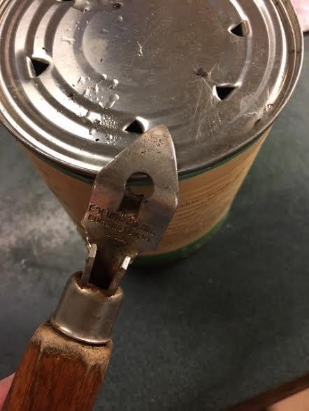 Step 1 Using a can opener, punch some