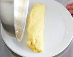 7 Rub the surface with butter, if desired. Figure 3.17a: Stir and scrape eggs until curds begin to form. Figure 3.17b: Roll omelet out of the pan onto a heated plate.