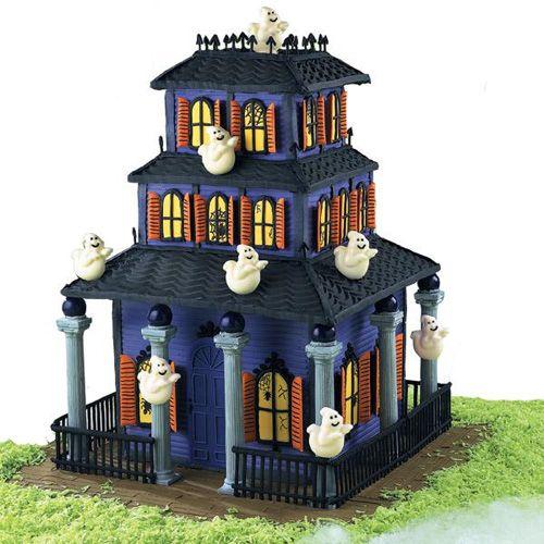 This old haunt is custom-built with Color Flow windows and doors, gingerbread roof panels and royal icing fences and turrets. What an adorably ghoulish baby shower cake this makes!