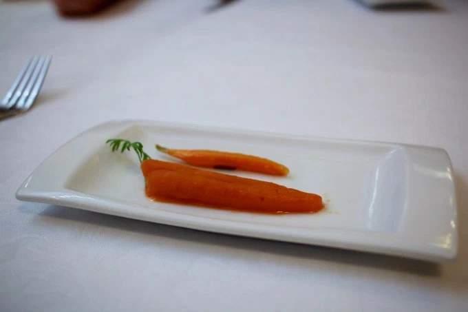 The palate cleanser (french Remise en Bouche) was called carrot candy. A carrot shaped, carrot sorbet served with a candied sliver of carrot.
