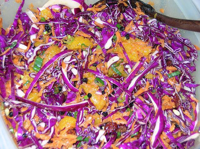 Purple Cabbage Salad Salad: 16 ounces shredded purple cabbage 1/3 cup chopped scallions 1/3 cup pine nuts 8 ounces shredded carrots 1 (11 ounce) can mandarin oranges, reserving juice 1-2 handfuls