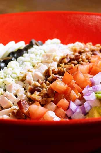 99 Crisp lettuce, topped with bacon, bleu cheese crumbles, fresh tomatoes, grilled chicken breast, avocado, red onions, cucumbers and black olives, served with your choice of dressing.