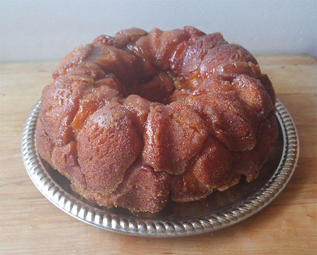 Easy Monkey Bread 1/2 cup granulated sugar 1 cup firmly packed brown sugar 1 teaspoon cinnamon 2 cans Pillsbury Grands biscuits (8 pack) 3/4 cup butter or margarine melted 1.