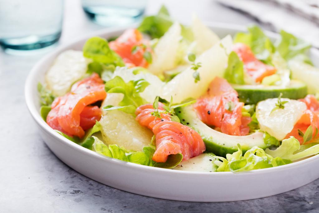 Grapefruit and Avocado Salad with Seared Salmon Ingredients: 1 Grapefruit 2 Large Bunches of Arugula 1 Ripe Avocado, Pitted & Sliced 2 Tbs Fresh Lemon Juice 2 Tbs Olive Oil ½ tsp Salt, divided ½ tsp