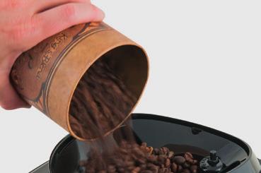 8 Slowly pour the coffee beans into