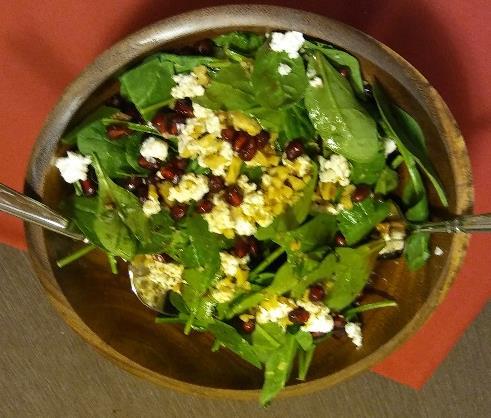 Salad: Spinach Salad with Pomegranate Vinaigrette Serves 4 Ingredients 1 package (5 ounces) baby spinach 1/2 cup pomegranate seeds (arils) 1/4 cup crumbled goat cheese 2 Tbsps.