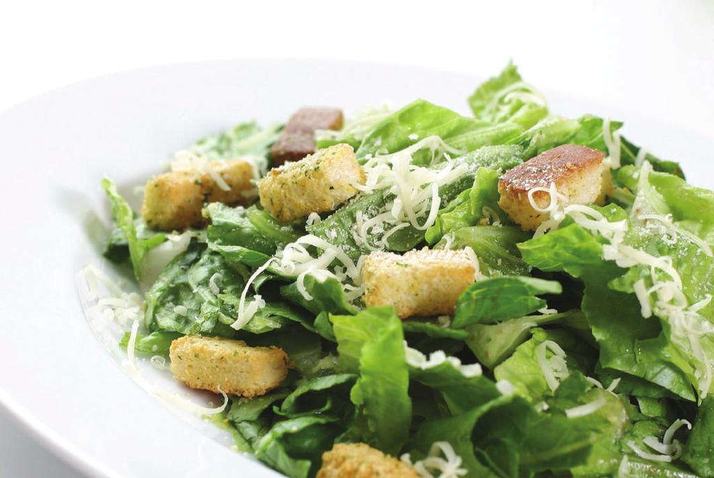 CAESAR SALAD Traditional Caesar salad with chopped romaine lettuce, garlic croutons and shaved Parmesan cheese. A creamy Caesar dressing is served on the side.