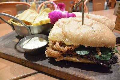 sandwich served with plantain chips. The Cubano was not your average Cubano sandwich.