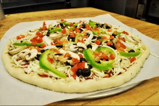 Preparing Pizza VEGETARIAN PIZZA -1 4oz ladle pizza sauce -2 Cups mozzarella cheese -1 grey scoop (#8) mushrooms -1
