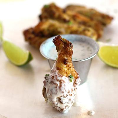 Jalapeño Lime Chicken Wings with Ranch Dressing For the wings: 2 jalapeño peppers 1 lime 4 cloves garlic 1/2 bunch cilantro 1/4 cup coconut oil 2 tablespoons coconut aminos 1 teaspoon ground cumin 2