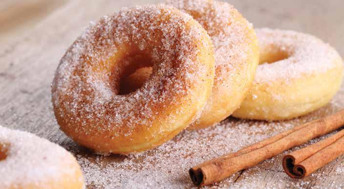 Doughnuts 1. Add the yeast, 1 3 cup sugar, and ½ cup milk to an electric mixer and mix. 2. Add the butter, flour, nutmeg, salt, and ½ tsp. cinnamon to a bowl to make a dry mixture. 3. Add the egg to the mixer and mix.