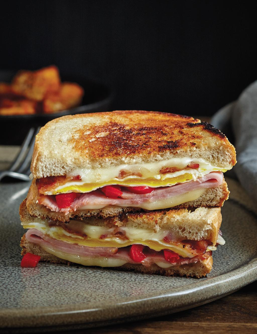 NEW ITEM GRILLED SANDWICH Egg, bacon, ham, roasted red peppers and Swiss cheese on rye