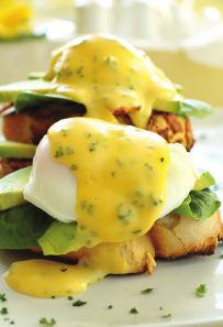 Eggs Benedict 6eggs 6 rounds thinly sliced ham 6 rounds buttered toast Mock Hollandaise sauce Parsley Prepare toast and on it place the ham, pan broiled. Keep this warm while poaching the eggs.