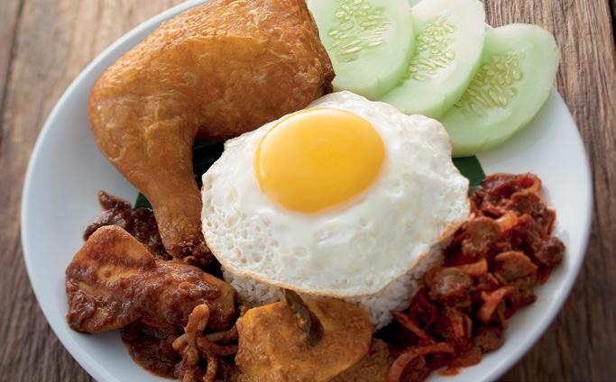 NASI LEMAK Coconut Milk infused steamed rice served with a choice of either fried chicken thigh, curry