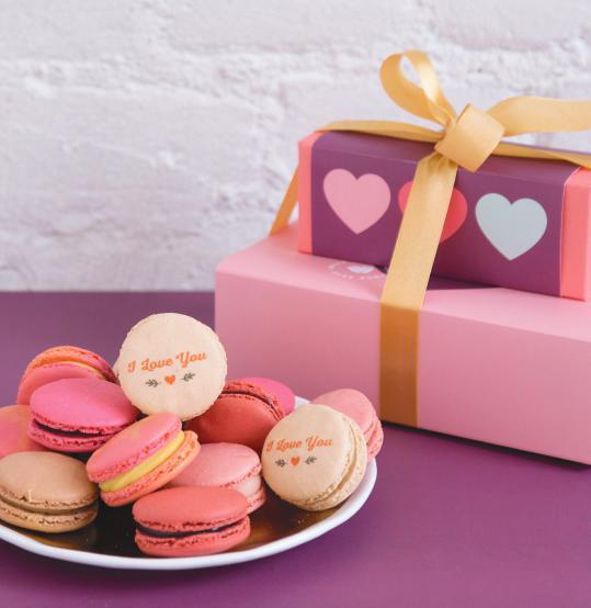 SWEET STACKS OF LOVE MACARONS AND COMBO STACKS Ready to impress? Our Sweet Stack of Love collection features our Woops! boxes stacked into a perfectly packaged gift that towers above the rest.