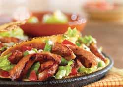 thinly-cut boneless chops (1/2-inch thick), cut into strips 8 small corn tortillas, warmed 1 cup shredded romaine lettuce 1 cup pico de gallo* Sour cream or crema to taste