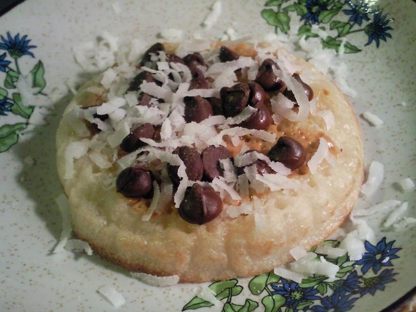 Crumpets with Peanut Butter, Choc Chips and Coconut Crumpet Peanut Butter Choc Chips Coconut Flakes On