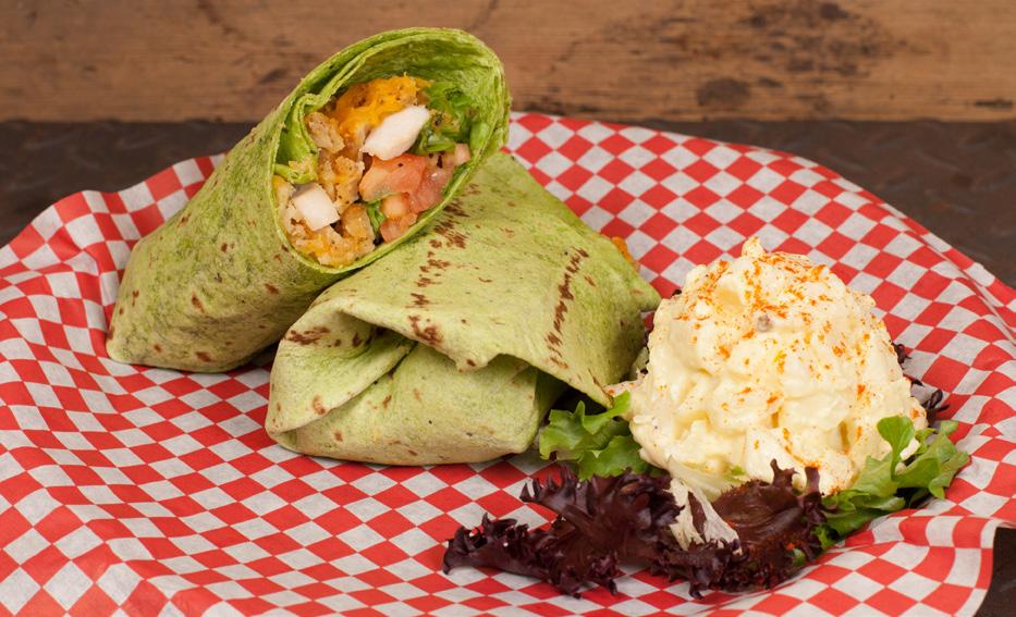 45 CHICKEN WRAP BREADED TENDERLOIN CHICKEN WRAP Choose grilled or crispy chicken wrapped in a flour or spinach tortilla with lettuce, tomato, cheddar cheese and honey mustard. 9.